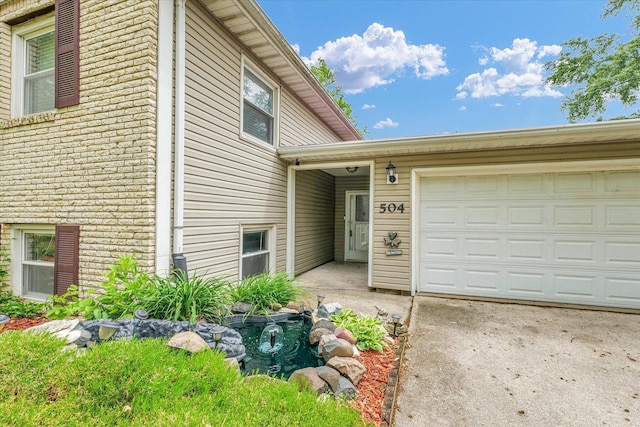 504 N 4th St, Saint Joseph, IL 61873 - view of front of property featuring brick siding and an attached garage