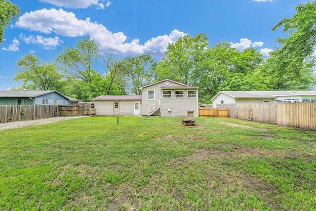 504 N 4th St, Saint Joseph, IL 61873 - rear view of house featuring a fire pit