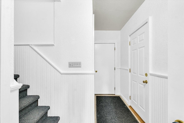 504 N 4th St, Saint Joseph, IL 61873 - staircase with a wainscoted wall