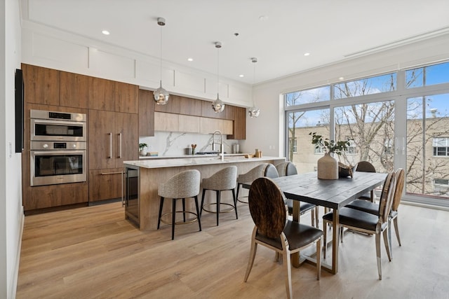 3951 N Wayne Ave Unit 404, Chicago, IL 60613 - dining room featuring plenty of natural light, recessed lighting, and light wood-type flooring