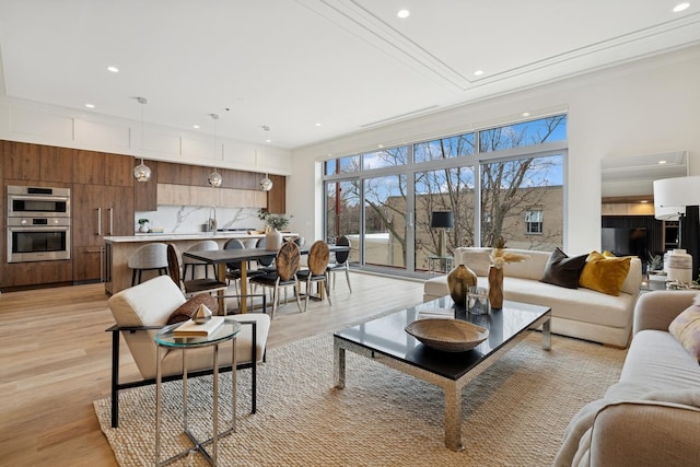 3951 N Wayne Ave Unit 404, Chicago, IL 60613 - living area featuring light wood-style flooring and crown molding