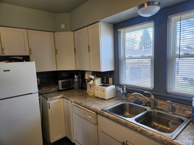 522 Gordon Ave, Calumet City, IL 60409 - kitchen with dark wood-type flooring, a sink, backsplash, white cabinetry, and white appliances