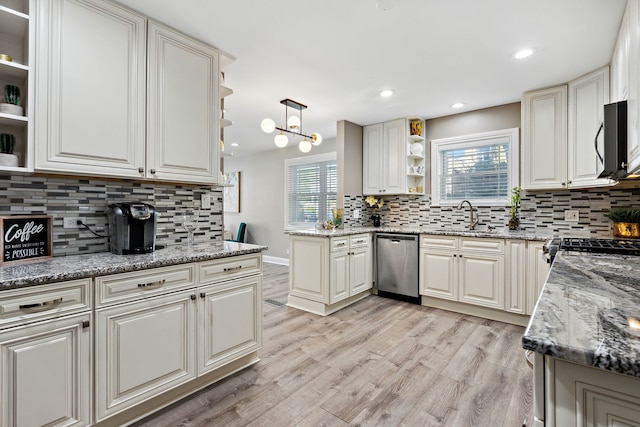 kitchen featuring a sink, open shelves, stainless steel appliances, and backsplash