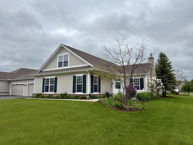 640 Schumann St, Woodstock, IL 60098 - view of front of property with a garage, a front yard, a chimney, driveway, and roof with shingles
