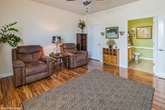 640 Schumann St, Woodstock, IL 60098 - sitting room with dark wood-type flooring, ceiling fan, and baseboards