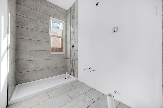 bathroom featuring a stall shower and tile patterned flooring