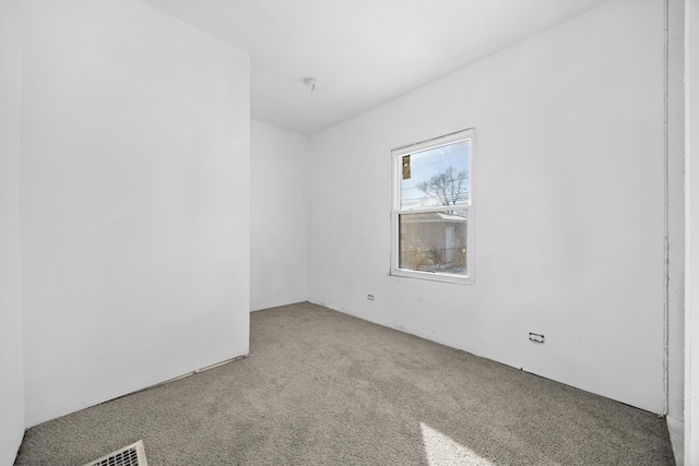 spare room featuring carpet flooring