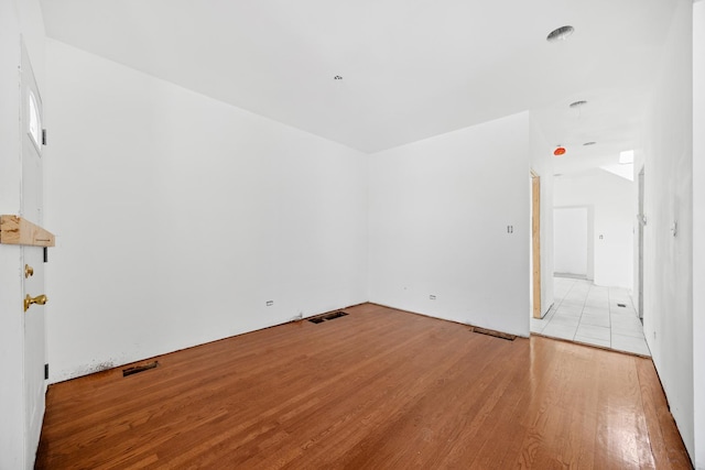 interior space with light wood-type flooring and visible vents