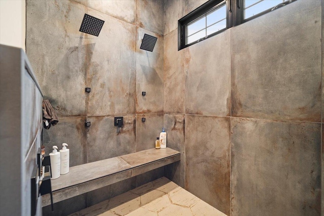 bathroom featuring a tile shower