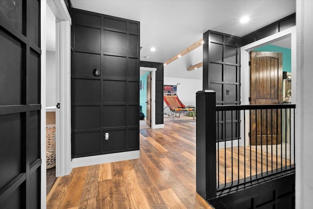 entryway featuring wood finished floors and recessed lighting