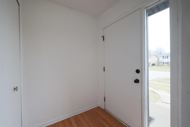 entryway featuring light wood-type flooring and baseboards