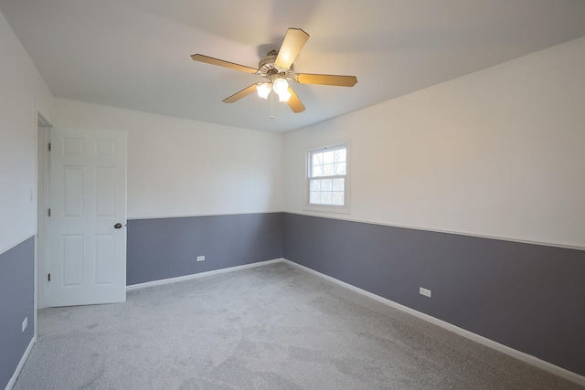 unfurnished room with carpet floors, ceiling fan, and baseboards