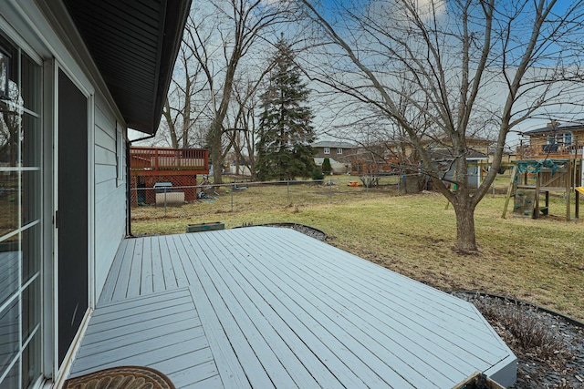 deck featuring a yard and a fenced backyard