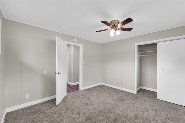 unfurnished bedroom with carpet floors, a ceiling fan, baseboards, and a closet