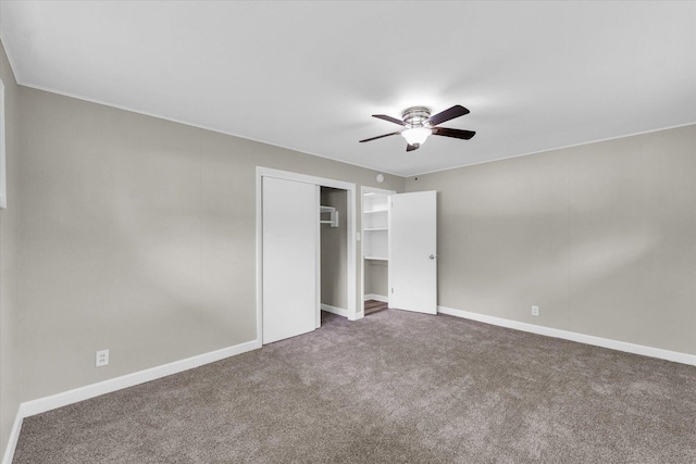 unfurnished bedroom featuring carpet floors, baseboards, ceiling fan, and a closet
