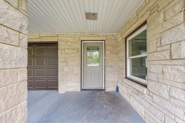 view of exterior entry with stone siding