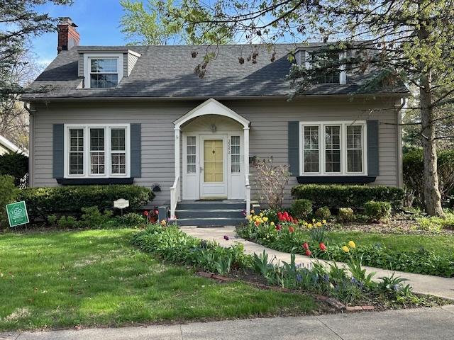 2242 Macdonald Ln, Flossmoor, IL 60422 - view of front of house featuring a chimney and a front yard