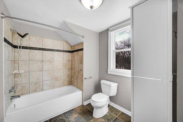 2242 Macdonald Ln, Flossmoor, IL 60422 - bathroom with stone finish flooring, vaulted ceiling, baseboards, toilet, and  shower combination