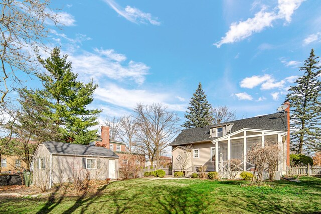 2242 Macdonald Ln, Flossmoor, IL 60422 - view of yard featuring a sunroom, fence, and an outbuilding
