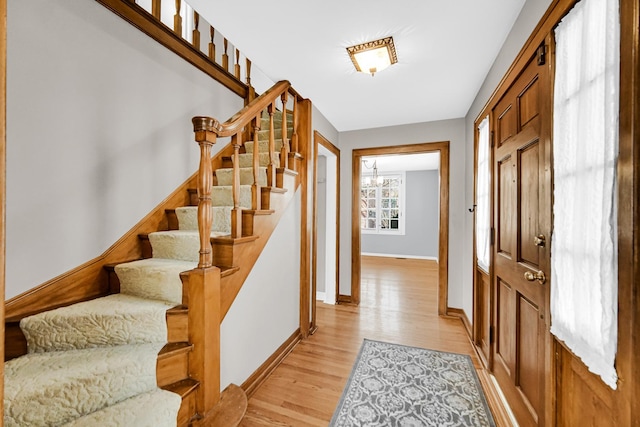 2242 Macdonald Ln, Flossmoor, IL 60422 - entrance foyer with baseboards, light wood finished floors, and stairway