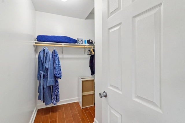 spacious closet featuring wood tiled floor