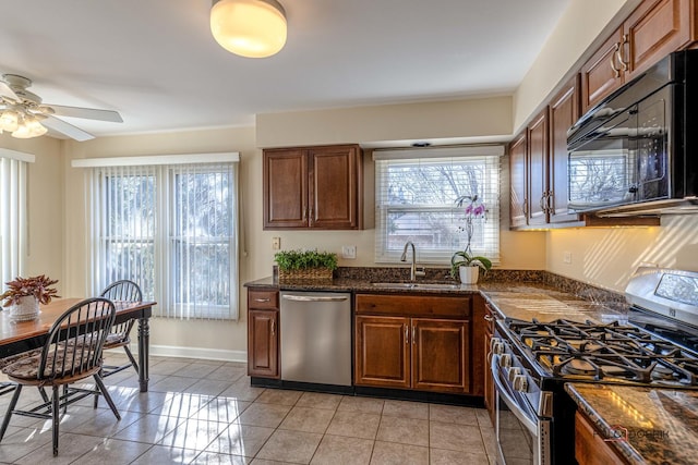 kitchen with ceiling fan, a sink, stainless steel appliances, and a wealth of natural light