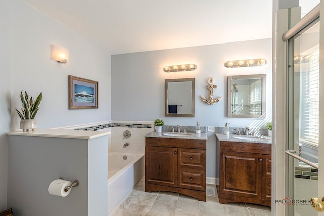 full bathroom with a garden tub and vanity