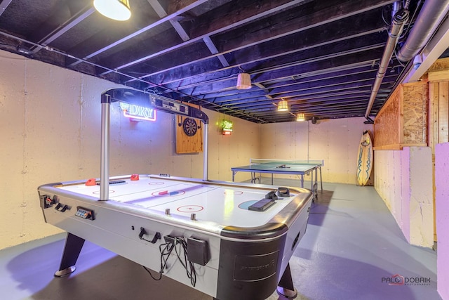 recreation room featuring concrete floors