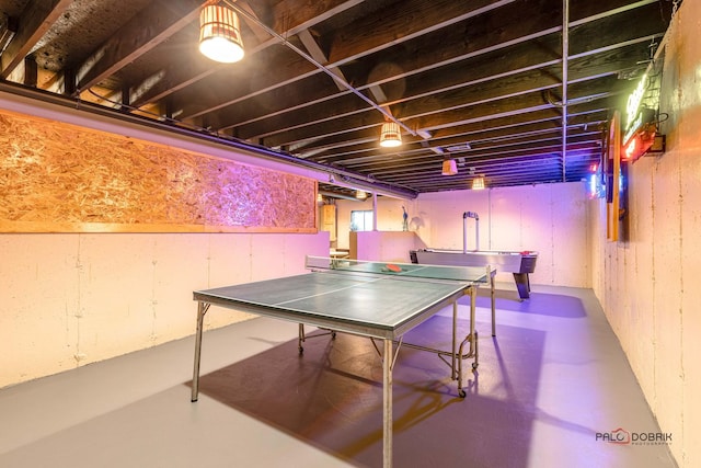 rec room featuring concrete floors
