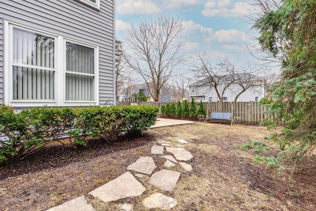 view of yard with fence and a patio area