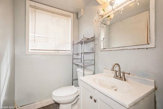 350 E Tulip Dr, Glenwood, IL 60425 - half bathroom featuring vanity and toilet