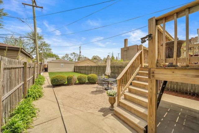view of patio / terrace with a fenced backyard and stairway