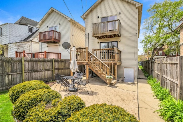 wooden terrace with an outbuilding, a residential view, and a fenced backyard