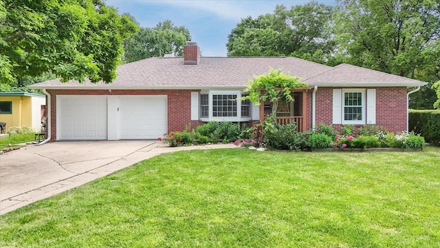 615 Haines Blvd, Champaign, IL 61820 - single story home with a front yard, brick siding, an attached garage, a chimney, and concrete driveway