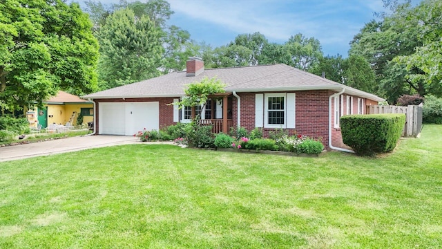 615 Haines Blvd, Champaign, IL 61820 - single story home featuring fence, a front lawn, brick siding, an attached garage, and concrete driveway