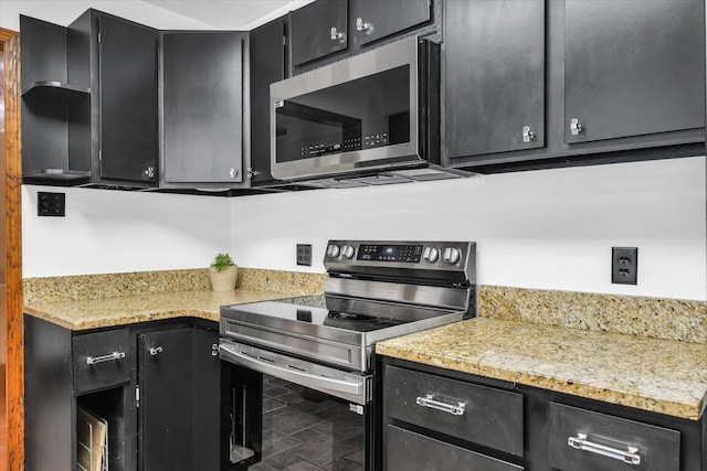 615 Haines Blvd, Champaign, IL 61820 - kitchen with appliances with stainless steel finishes, light countertops, and dark cabinets