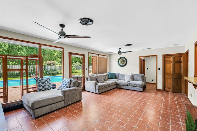 615 Haines Blvd, Champaign, IL 61820 - living area with visible vents, a ceiling fan, and tile patterned flooring