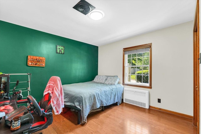 615 Haines Blvd, Champaign, IL 61820 - bedroom with radiator, wood finished floors, and baseboards