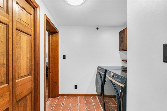 615 Haines Blvd, Champaign, IL 61820 - clothes washing area with cabinet space, light tile patterned floors, baseboards, and washing machine and dryer