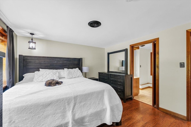 615 Haines Blvd, Champaign, IL 61820 - bedroom featuring dark wood-type flooring and baseboards