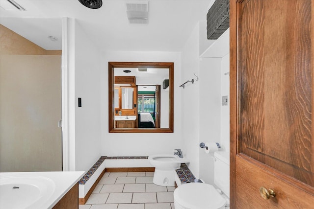 615 Haines Blvd, Champaign, IL 61820 - bathroom featuring vanity, ensuite bath, tile patterned flooring, visible vents, and toilet
