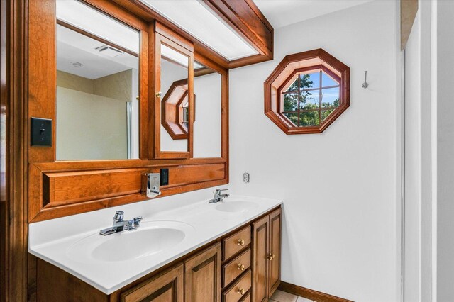 615 Haines Blvd, Champaign, IL 61820 - bathroom with double vanity, a sink, and visible vents