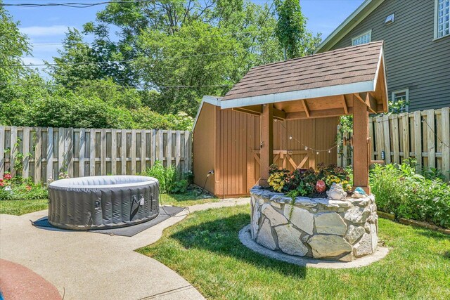 615 Haines Blvd, Champaign, IL 61820 - view of yard featuring cooling unit, a storage unit, a fenced backyard, and an outdoor structure