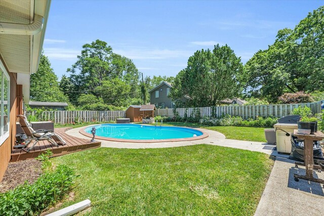 615 Haines Blvd, Champaign, IL 61820 - view of swimming pool featuring a yard, a fenced backyard, a fenced in pool, and a wooden deck