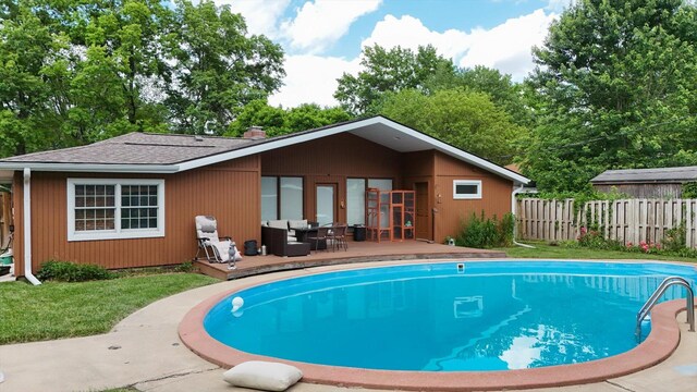 615 Haines Blvd, Champaign, IL 61820 - rear view of property with an outdoor living space, a wooden deck, a fenced in pool, and fence