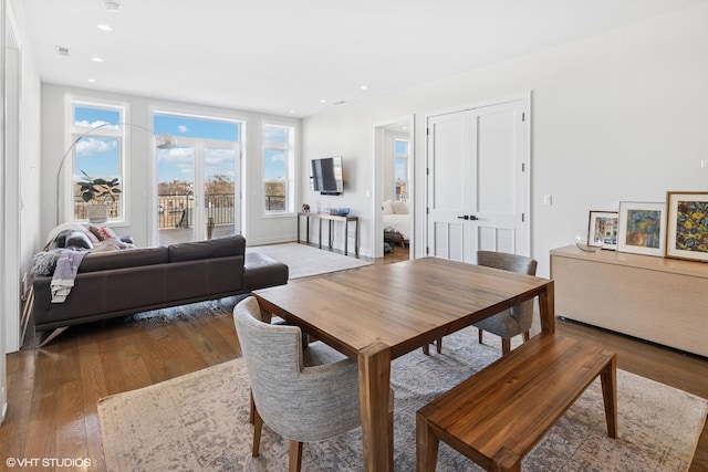 dining area with a healthy amount of sunlight, recessed lighting, and wood finished floors