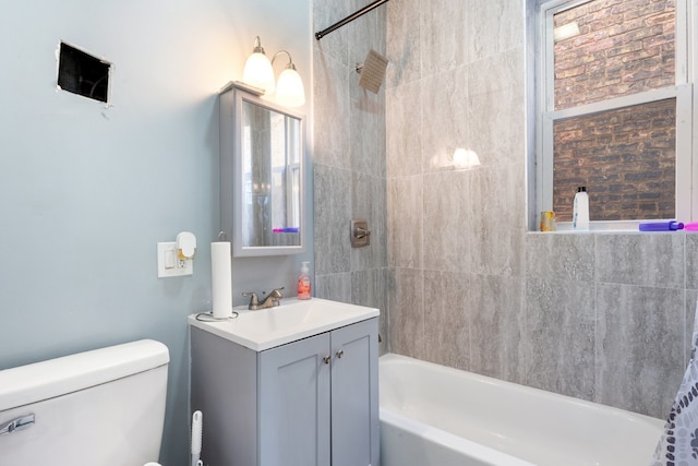 full bathroom featuring vanity,  shower combination, and toilet