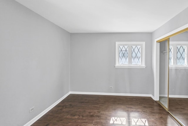 foyer entrance featuring wood finished floors and baseboards