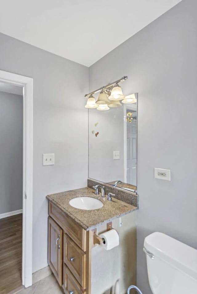 half bath with vanity and toilet