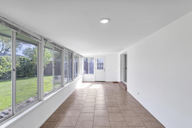 unfurnished sunroom with tile patterned floors